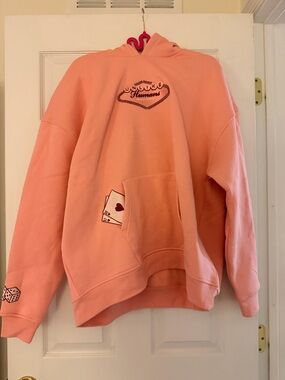 Unlike Humans pink women’s Las Vegas Graphic Hoodie